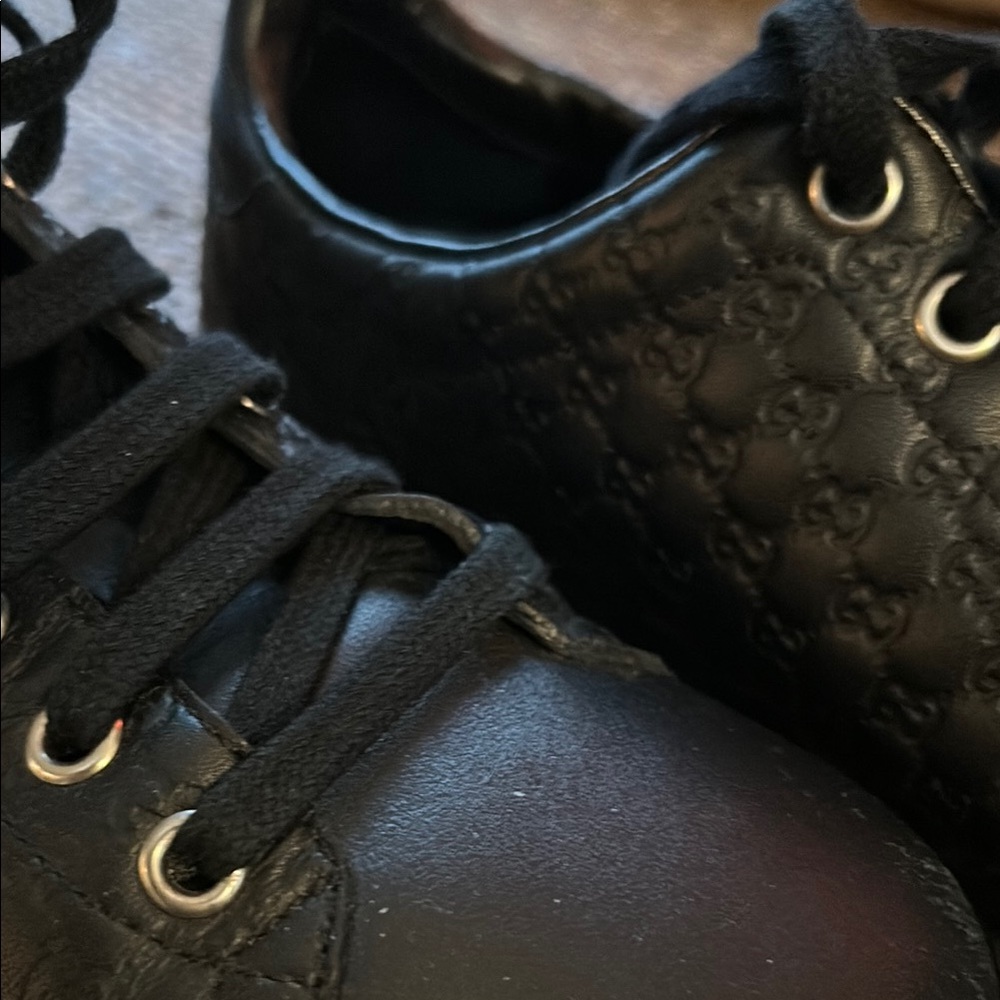 Gucci Black Quilted Sneakers with Gold Eyelets
